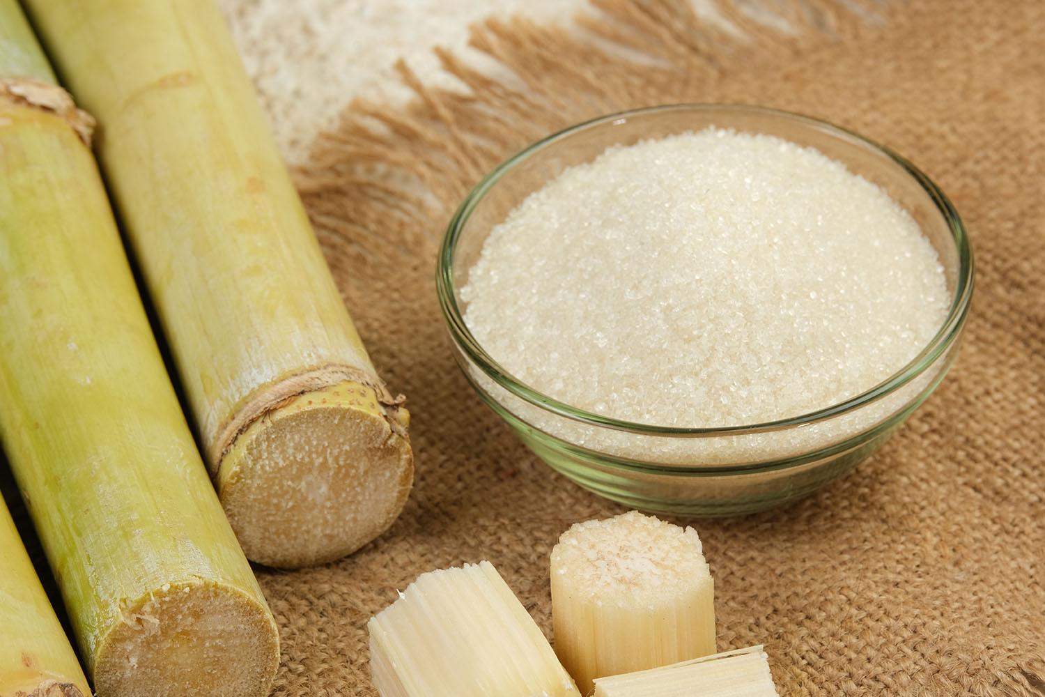 Refined sugar crystals with sugar cane