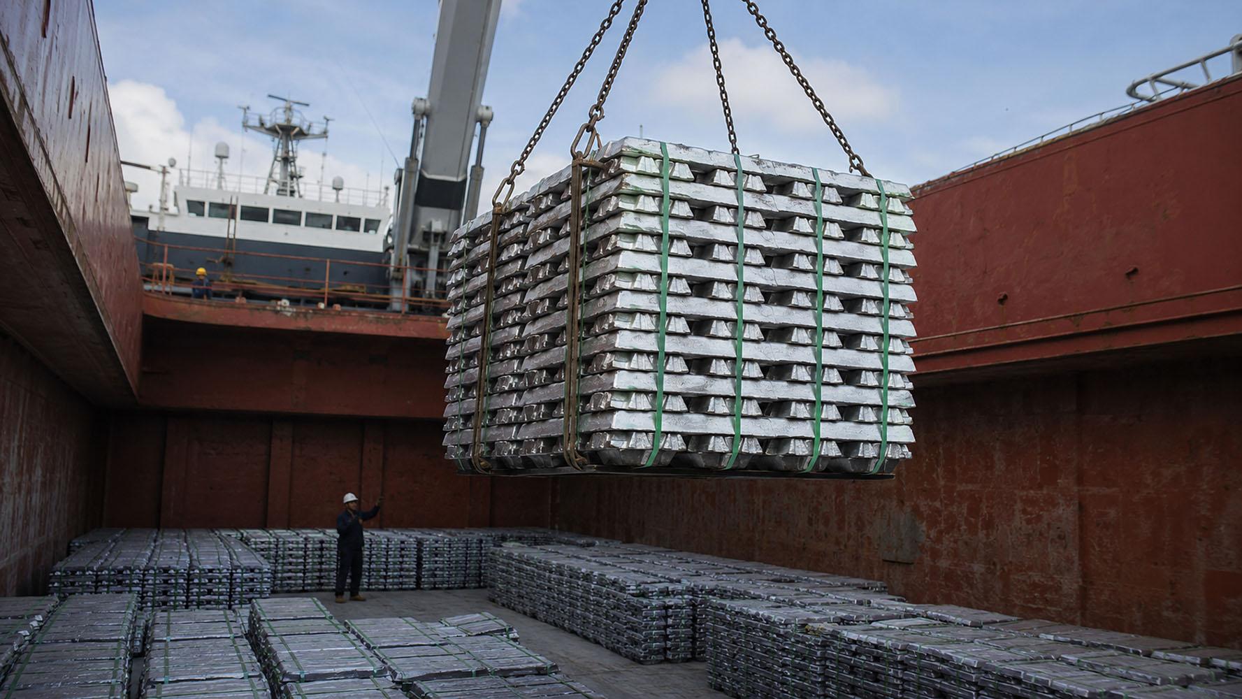 Aluminium ingots being loaded into a cargo vessel