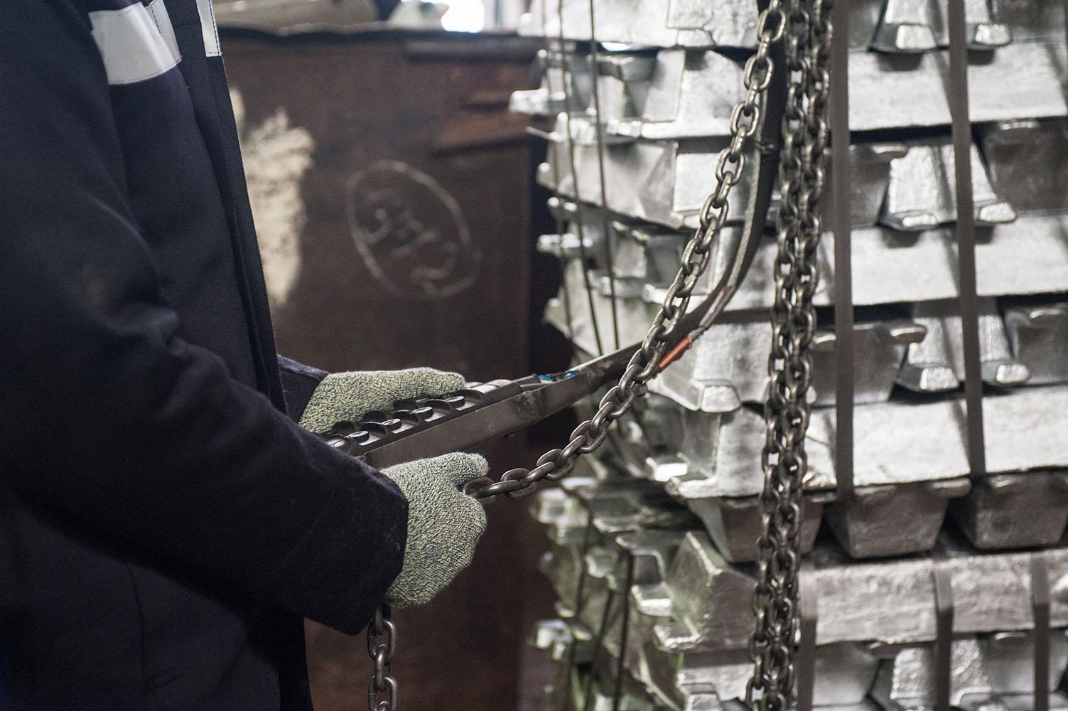 Aluminium ingots being secured for handling